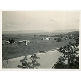 Beehives on River Farm (photograph taken from across the Hawkesbury river), mountain range in the distance [Hawkesbury Agricultural College (HAC)]