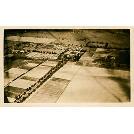 Aerial views of Hawkesbury Agricultural College, showing administrative and accommodation blocks, stable square, dairy and orchard buildings, and the front drive [Hawkesbury Agricultural College (HAC)] - Print 1 of 2
