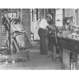 Engineering Workshop (interior) - Student at work [Hawkesbury Agricultural College (HAC)]