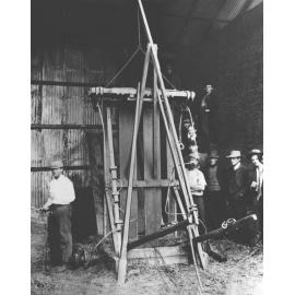 Press for making hay bales - staff & students standing around [Hawkesbury Agricultural College (HAC)]