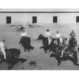 Riding School - Students (all wearing hats) mounted on horses inside Stable Square [Hawkesbury Agricultural College (HAC)]