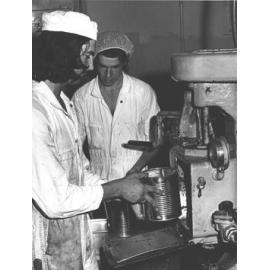 Cannery: Student putting large can of produce into an oven [Hawkesbury Agricultural College (HAC)]