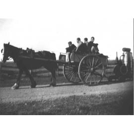 Horse-drawn tip dray (with four students) pulling a trailer with a petrol engine [Hawkesbury Agricultural College (HAC)]
