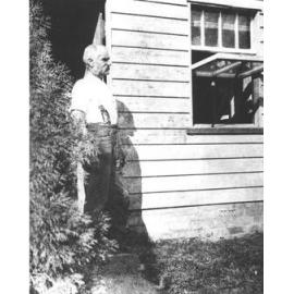 Hugh Reid, Gardener at the College, standing in doorway [Hawkesbury Agricultural College (HAC)]