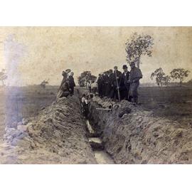 Draining the Orchard, 1892' - two men standing in trough, pipes, others standing on sides of trough, not workers - Cropped (Print 2 of 2) [Hawkesbury Agricultural College (HAC)]