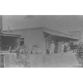 Cannery and Packing Shed (exterior) - various barrels and crates near the building [Hawkesbury Agricultural College (HAC)]