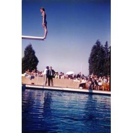 Olympic Swimming Pool - Opening - A woman preparing to dive from the diving board [Hawkesbury Agricultural College (HAC)]