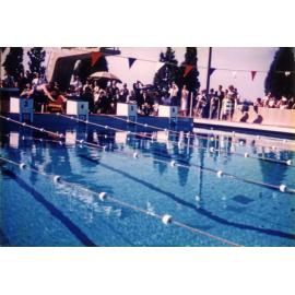Olympic Swimming Pool - Opening (print 17 of 18) - Andrew 'Boy' Charlton (ex-student) taking the first official swim [Hawkesbury Agricultural College (HAC)]