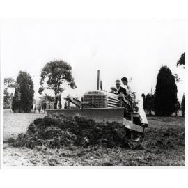 Olympic Swimming Pool Construction - Mr Roger B Nott, Minister for Agriculture and Food Production, turning first sod for the new pool in a bulldozer [Hawkesbury Agricultural College (HAC)]