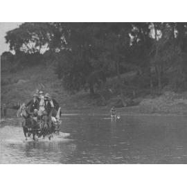 Students crowded onto a cart pulled by two horses, crossing the Nepean River at Yarramundi Ford [Hawkesbury Agricultural College (HAC)]