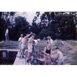 Olympic Swimming Pool - Construction (print 06 of 18) - Students and staff pouring concrete for a section of wall using mechanical vibrators for compaction [Hawkesbury Agricultural College (HAC)]