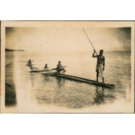 Fishing from a canoe off New Britain Island