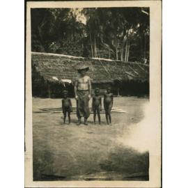 Bob Burrows with Native Children - Cassia Village (near Hoskins Airfield, New Britain Island, Papua New Guinea)