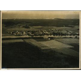 Aerial Photograph - Unidentified coastal town on a river