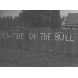 Empire Day - Student prank - 'Beware of the Bull' painted on the fence of the Principal's residence [Hawkesbury Agricultural College (HAC)]