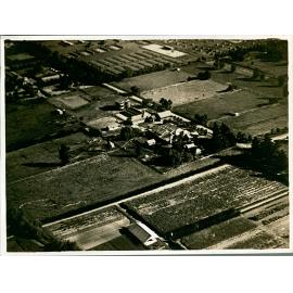 Aerial view of Hawkesbury Agricultural College showing the dairy buildings in the centre with the poultry buildings behind [Hawkesbury Agricultural College (HAC)] - Print 1 of 2 - Cropped