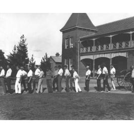 Students standing on the drive outside the Eastern Tower block, participating in a fire brigade drill [Hawkesbury Agricultural College (HAC)]
