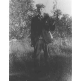 Spence Reid - Manager of the River Farm, standing in a paddock [Hawkesbury Agricultural College (HAC)]