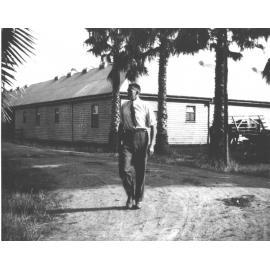 Wallace R (Roy) Watkins, Farm Manager, walking past Stable Square [Hawkesbury Agricultural College (HAC)]