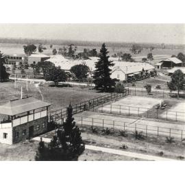 Sports pavilion (grandstand) and tennis courts with Stable Square in background - Print 2 of 2 (cropped) [Hawkesbury Agricultural College (HAC)]